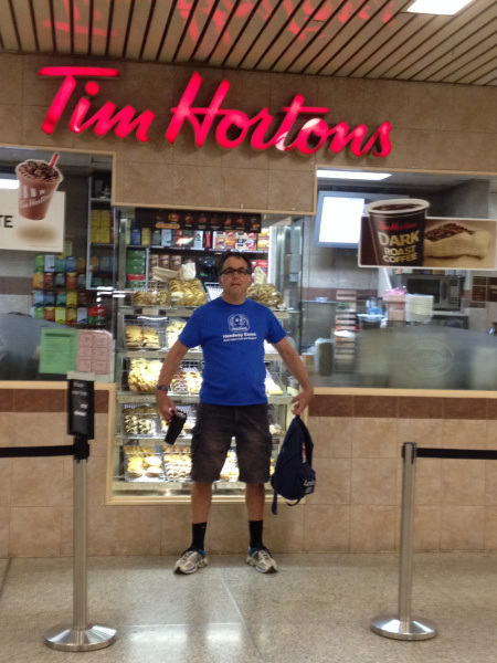 Rob in front of Tim Hortons – a Canadian favourite for coffee lovers