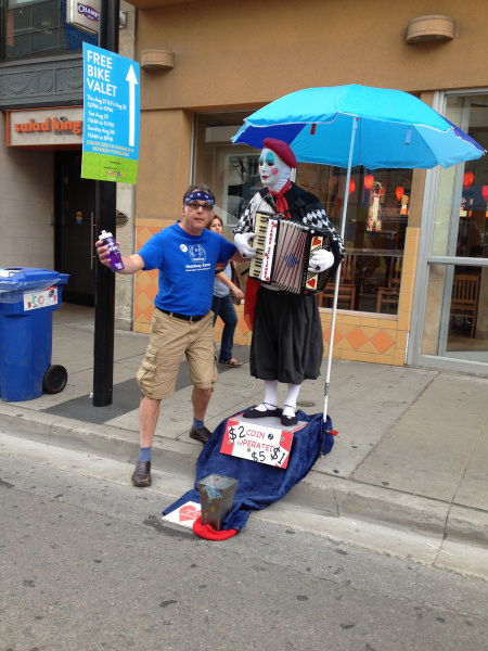Rob poses with a street performer at BuskerFest
