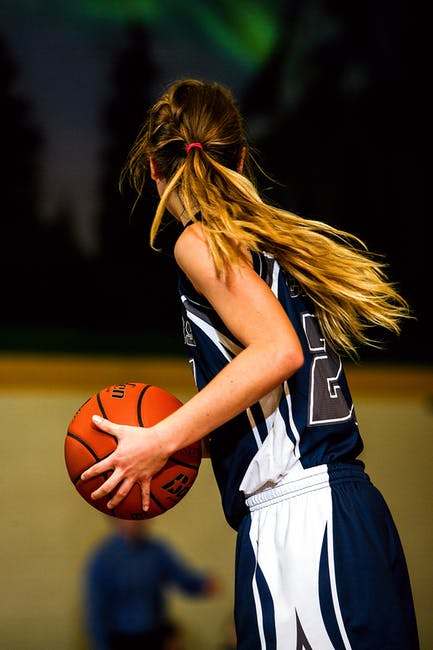 Woman playing basketball