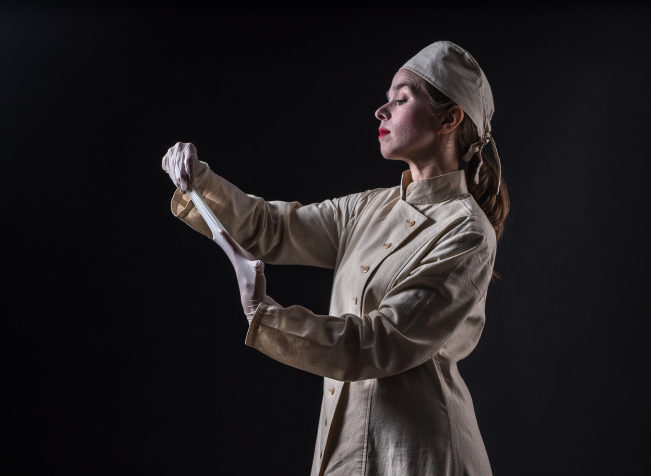 Woman in old fashioned surgeon's uniform - still from Brain Storm