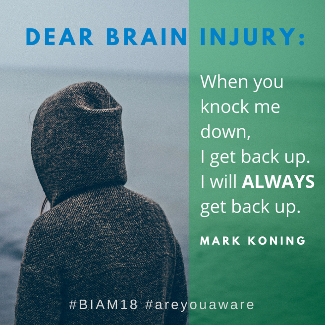 Dear Brain Injury, when you knock me down I get back up. I will ALWAYS get back up. - Mark Koning Person wearing a grey hoodie, from the back, looking at the ocean