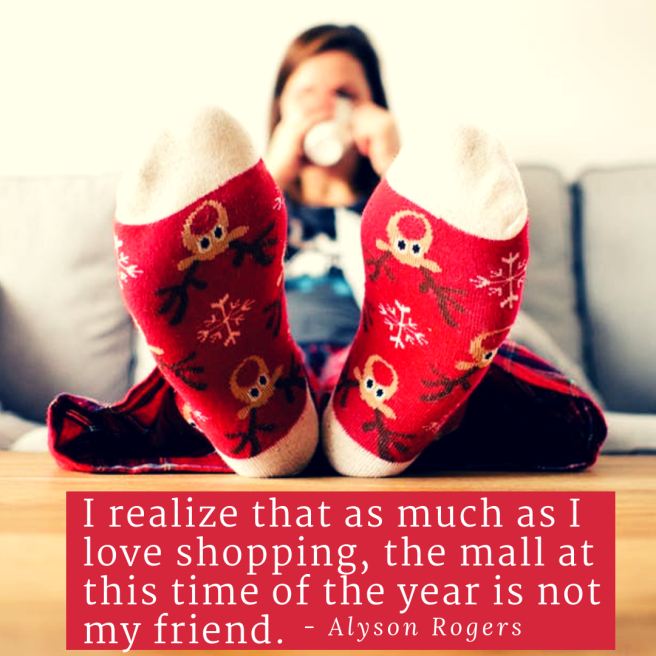 Woman drinking a hot drink on a grey couch wearing red christmas socks with snow flakes and reindeer