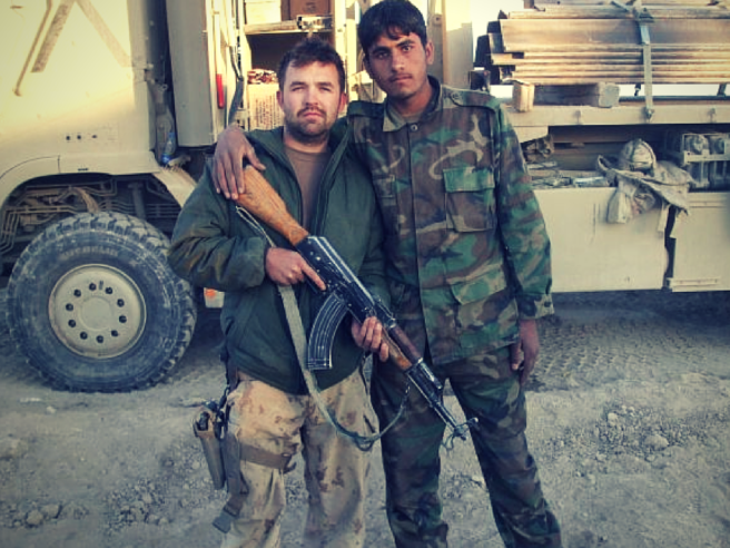 CORPORAL MACDONALD WITH AN AFGHAN NATIONAL