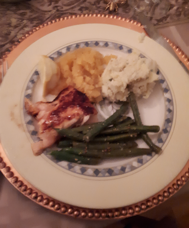 a plate with green beans, pork dressed with homemade ketchup, squash and potatoes